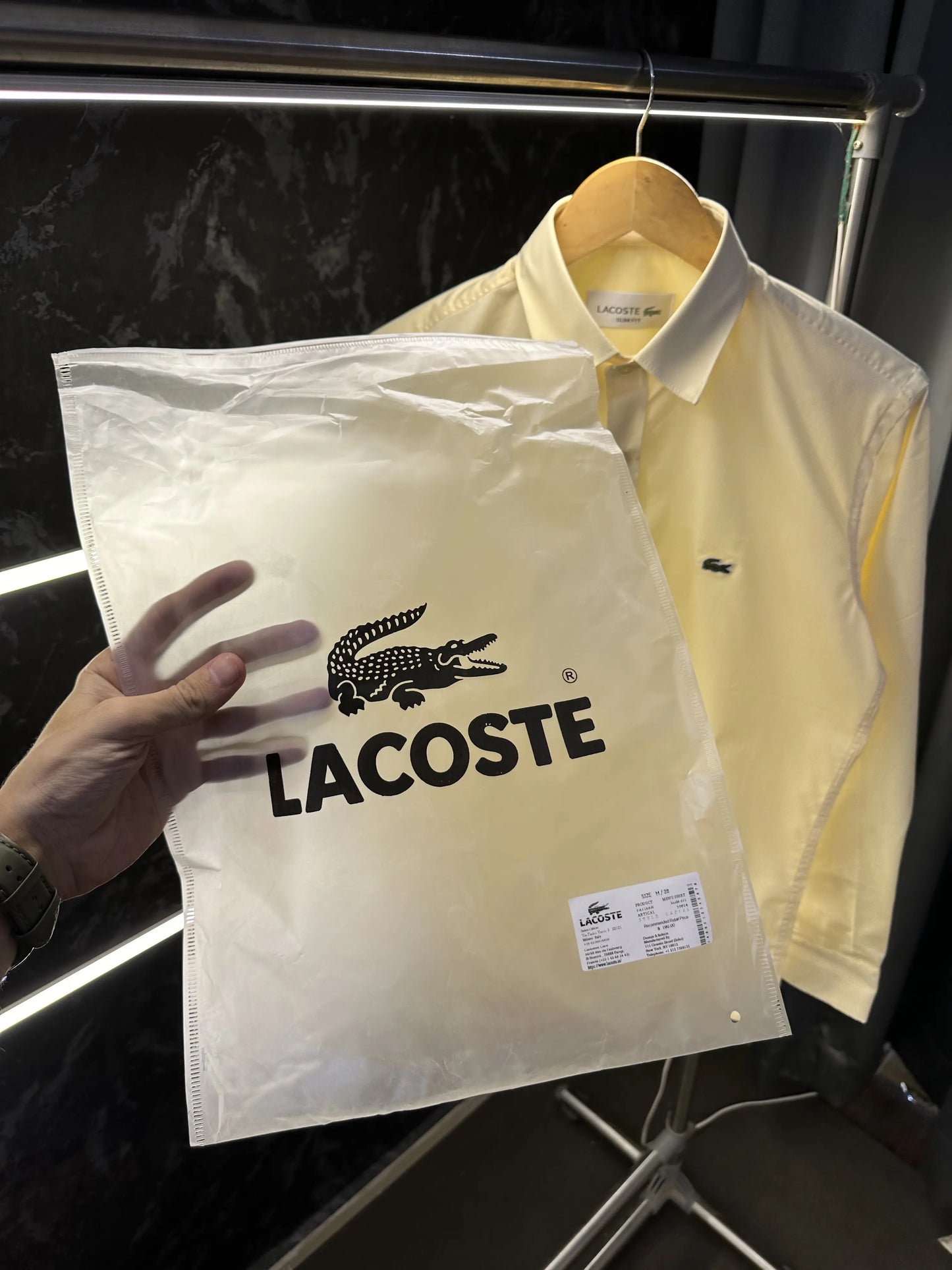 Lacost_e Store article shirt with brand poly bag Yellow