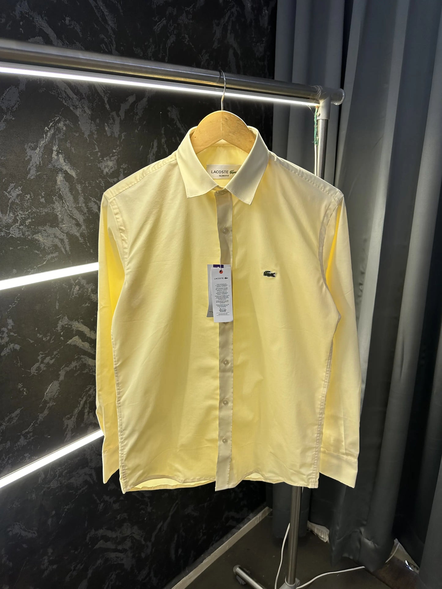 Lacost_e Store article shirt with brand poly bag Yellow