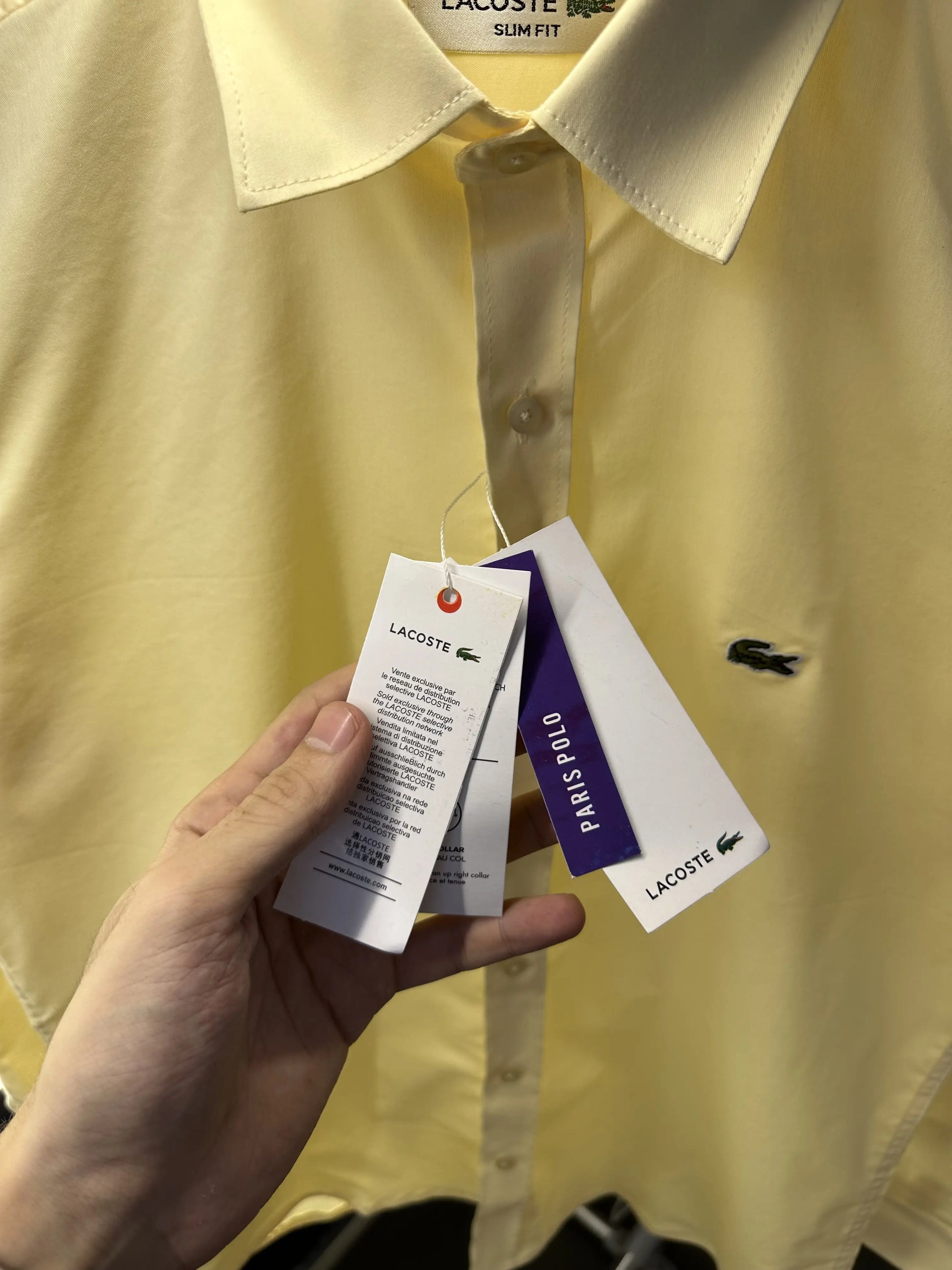 Lacost_e Store article shirt with brand poly bag Yellow