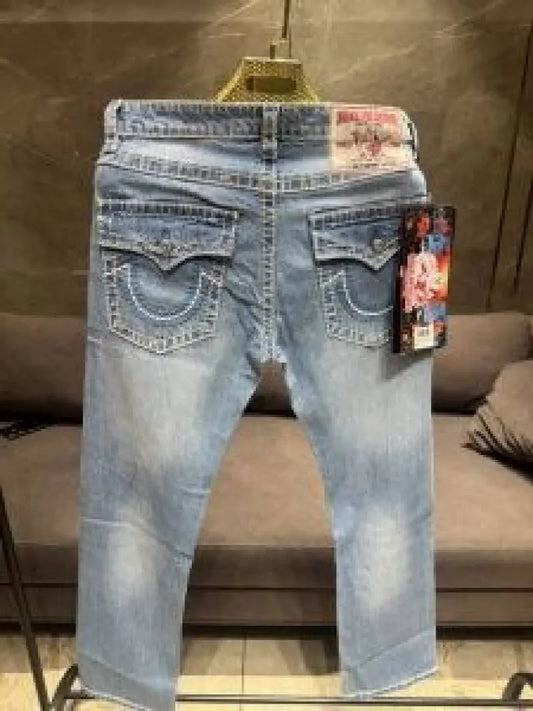 TRUE RELIGION PREMIUM LIGHT WASH PREMIUM THREAD IMPORTED DENIM